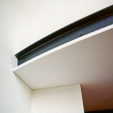 a multilevel apartment elegantly detailed using curving steel floor beams